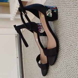 Black strappy block heels with silky floral embroidery